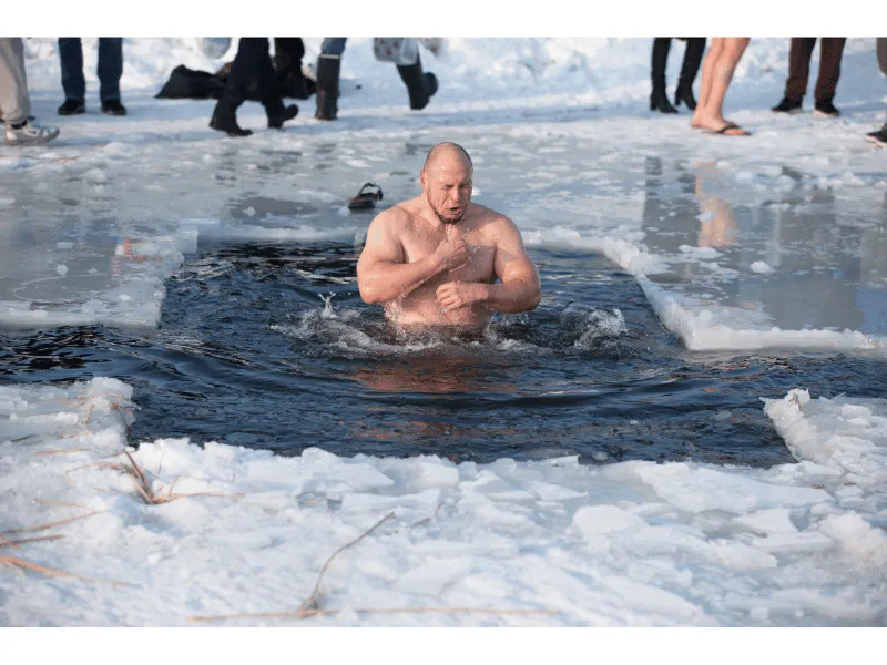 Man taking a polar ice plunge