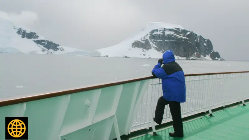 A person on the deck of an Antarctica cruise ship